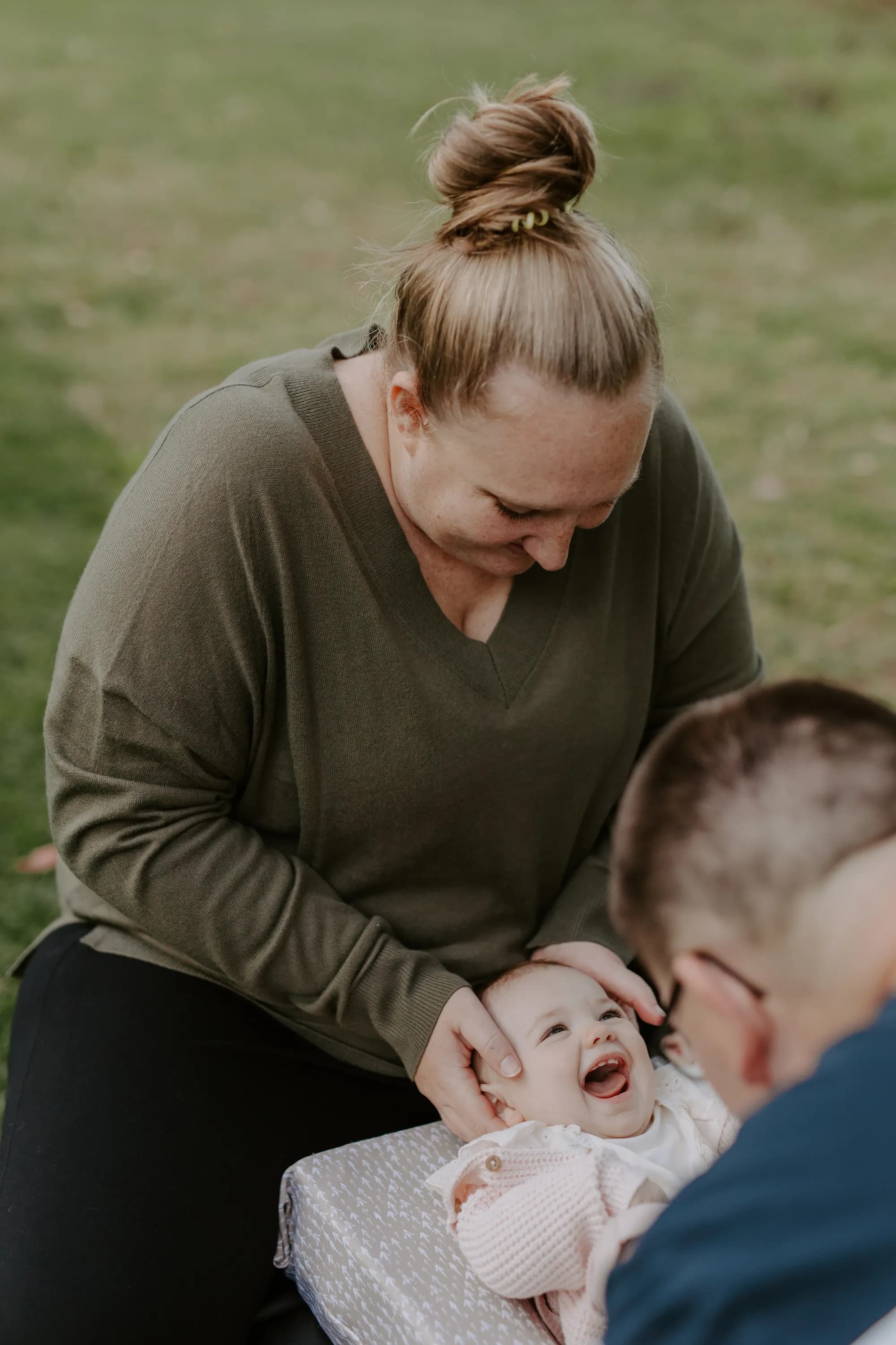 A mother and laughing baby after pediatric chiropractic care in Oceanside
