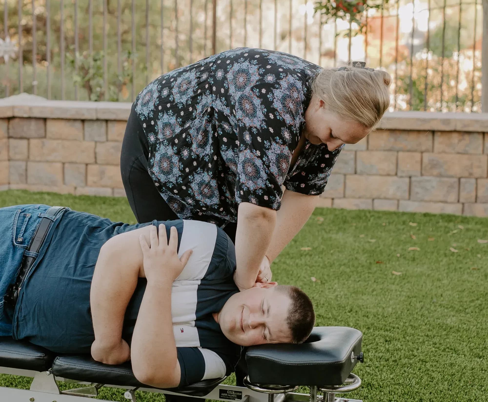 Dr. Caitlin Walker performing a gentle side-lying upper cervical adjustment for headache relief in Oceanside