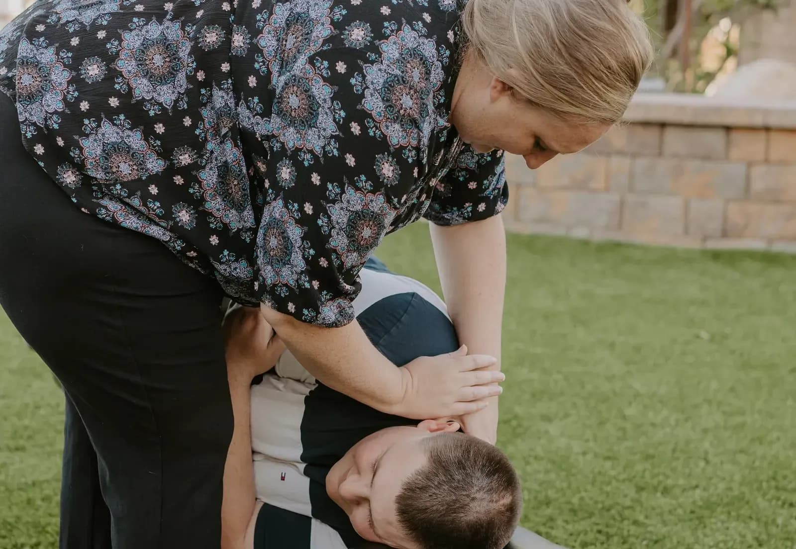 Dr. Caitlin Walker delivering a gentle side-lying upper cervical adjustment with no twisting of the neck