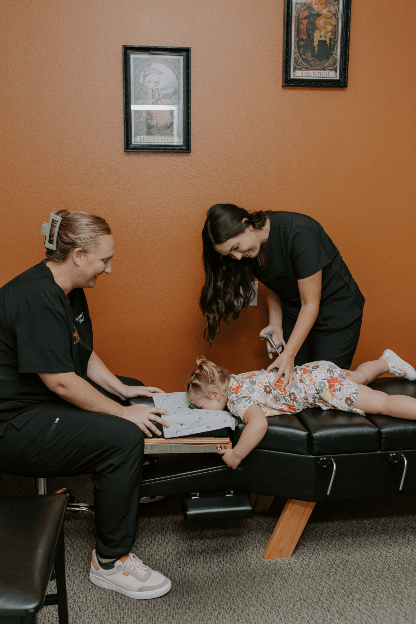Toddler lying on the adjusting table during a gentle visit to an Oceanside chiropractor