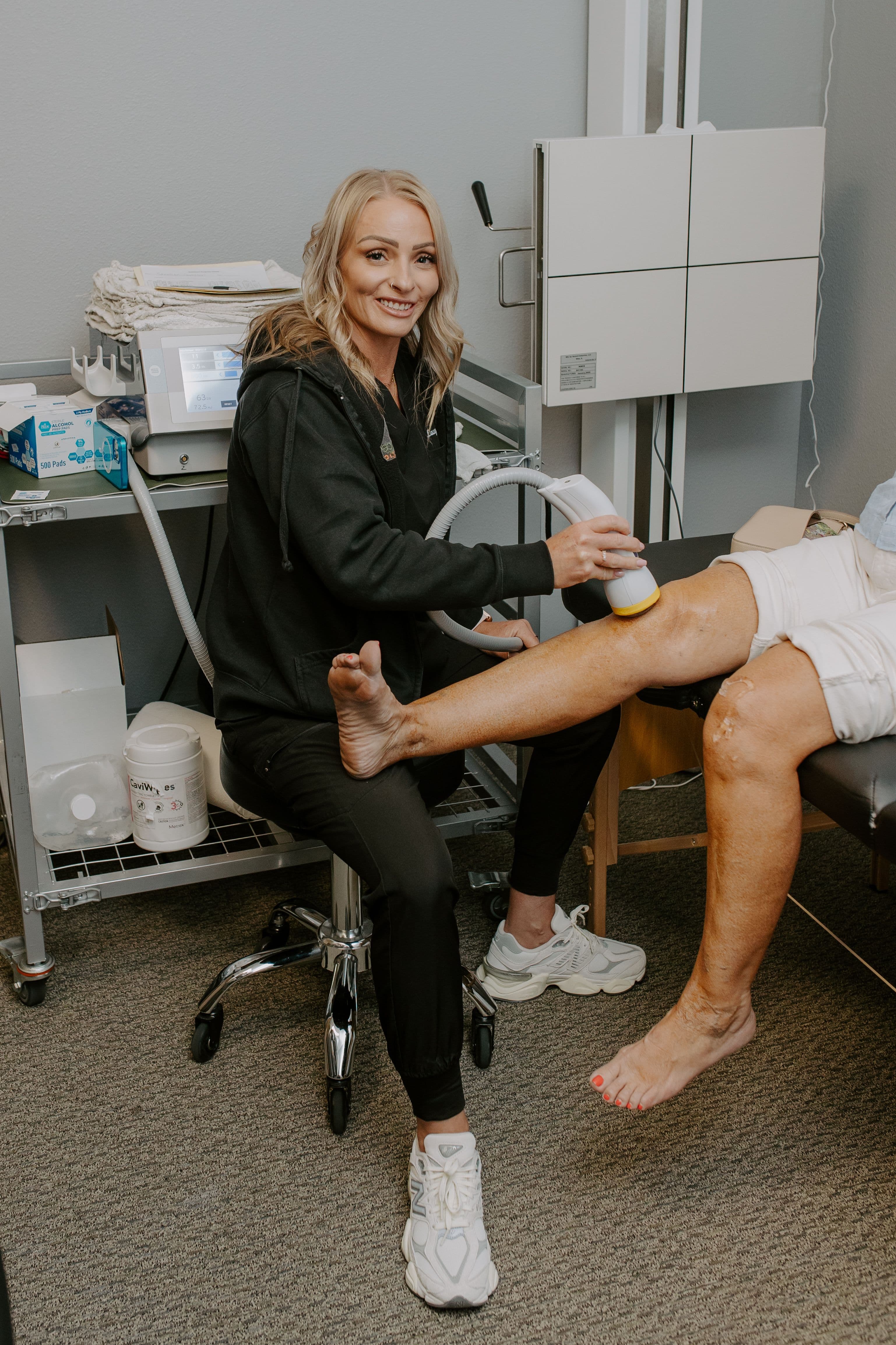 SoftWave therapy applied to a patient's knee at our Oceanside chiropractor's office