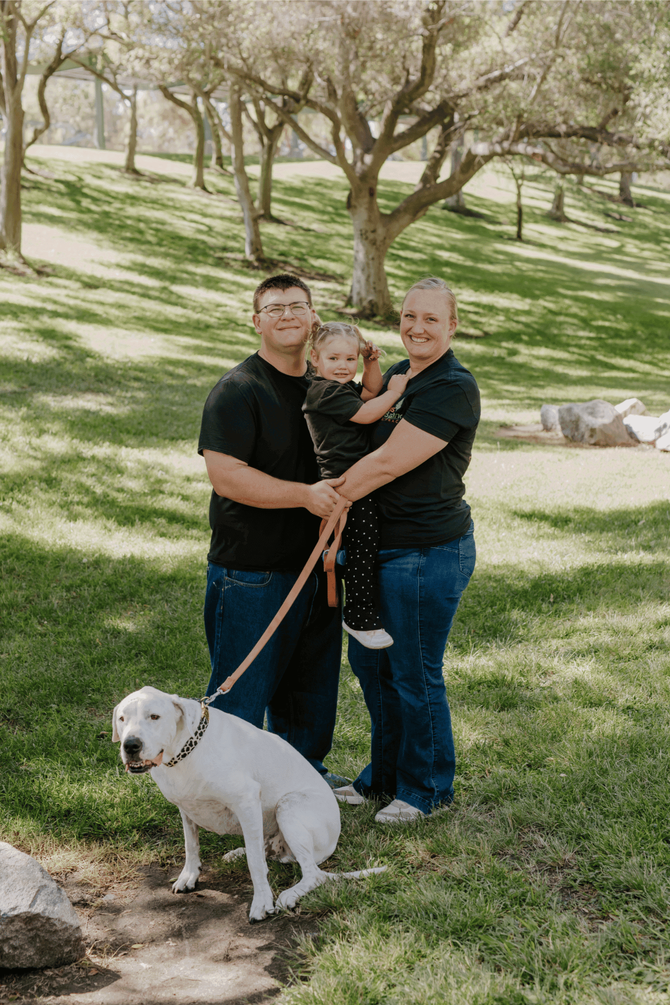 Mom, dad, young daughter and dog, representing family care at our Oceanside chiropractor
